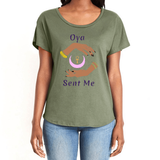 Feel the magic of wearing this comfortable military green women's T-Shirt with the name of the West African goddess Oya, and the message - "Oya Sent Me" in dark purple letters. It has brilliant graphics of hands circling a new moon with an ankh. Fabric laundered for relaxed fit.