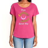 Feel the magic of wearing this pink comfortable women's T-shirt with the name of the West African goddess Oya, and the message - "Oya Sent Me" in white letters. It has brilliant graphics of hands circling a new moon with an ankh. It is fabric laundered for relaxed fit.