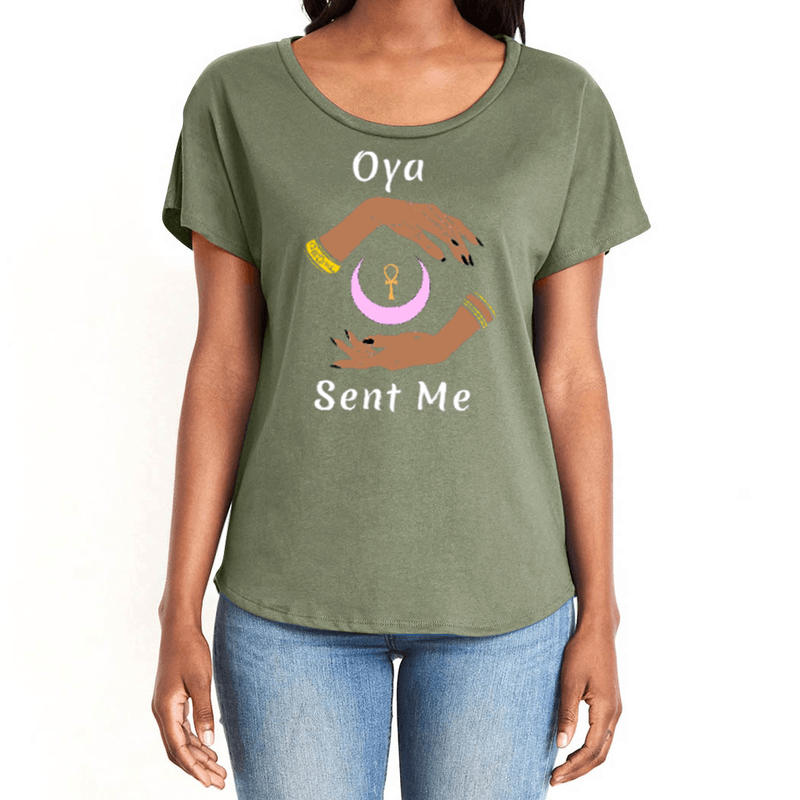 Feel the magic of wearing this military green comfortable women's T-shirt with the name of the West African goddess Oya, and the message - "Oya Sent Me" in white letters. It has brilliant graphics of hands circling a new moon with an ankh. It is fabric laundered for relaxed fit.