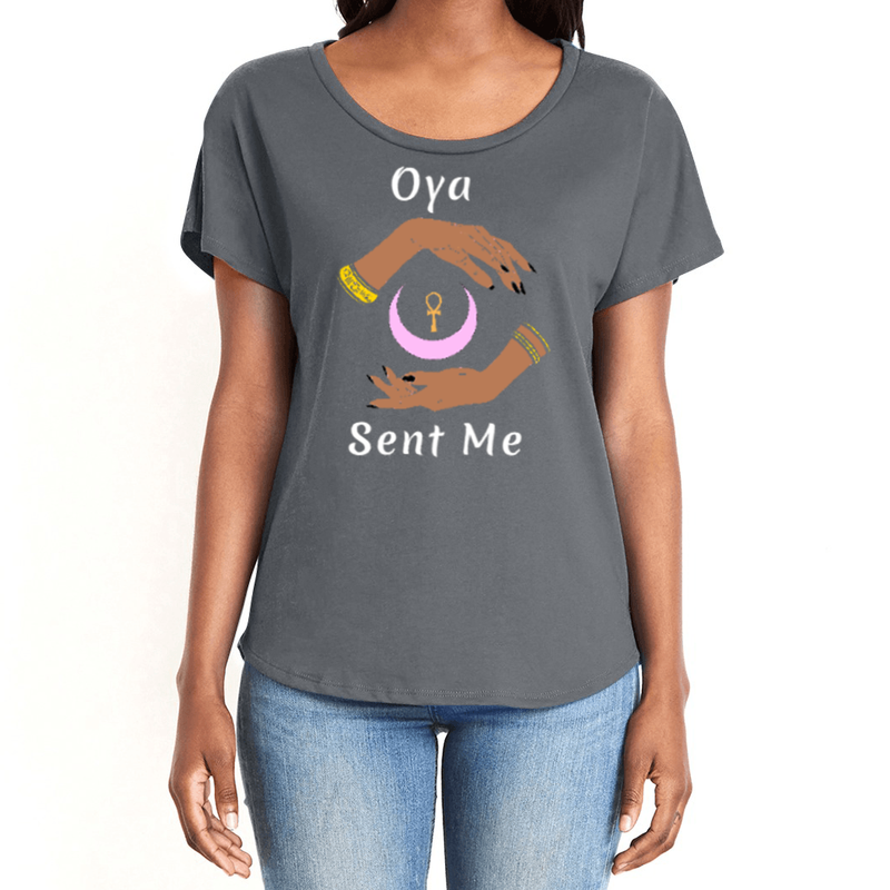 Feel the magic of wearing this dark grey comfortable women's T-shirt with the name of the West African goddess Oya, and the message - "Oya Sent Me" in white letters. It has brilliant graphics of hands circling a new moon with an ankh. It is fabric laundered for relaxed fit.