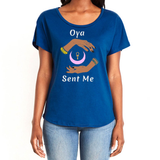 Feel the magic of wearing this royal blue comfortable women's T-shirt with the name of the West African goddess Oya, and the message - "Oya Sent Me" in white letters. It has brilliant graphics of hands circling a new moon with an ankh. It is fabric laundered for relaxed fit.