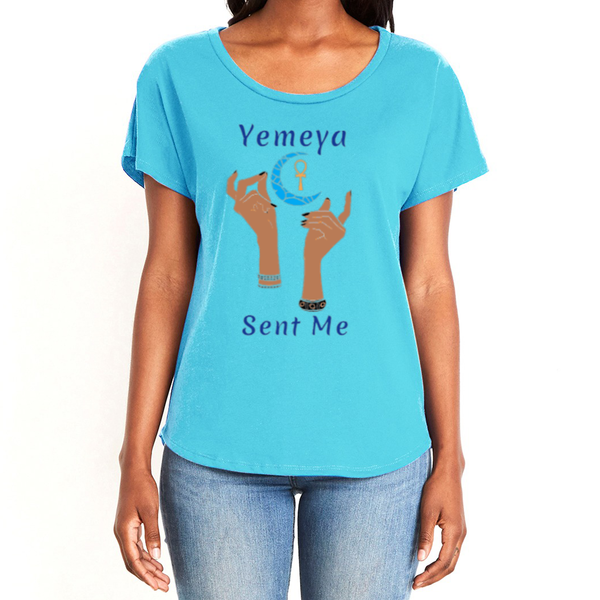 Show your true power in this magical women's light blue  T-shirt with the name of the West African goddess Yemeya, in dark blue letters, and the message "Yemeya Sent Me." It also has a brilliant graphic of hands reaching upwards to a new moon and an ankh. It is fabric laundered for relaxed fit.