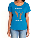 Show your true power of being, in this magical blue women's T-shirt with the name of the West African goddess Yemeya, and the message "Yemeya Sent Me," in white letters. It also has a brilliant graphic of hands reaching upwards to a new moon and an ankh. It is fabric laundered for relaxed fit.